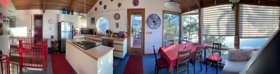 Kitchen and dining room and door to outside deck