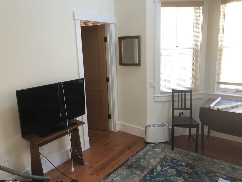 Half-bath is to the right of the TV.
