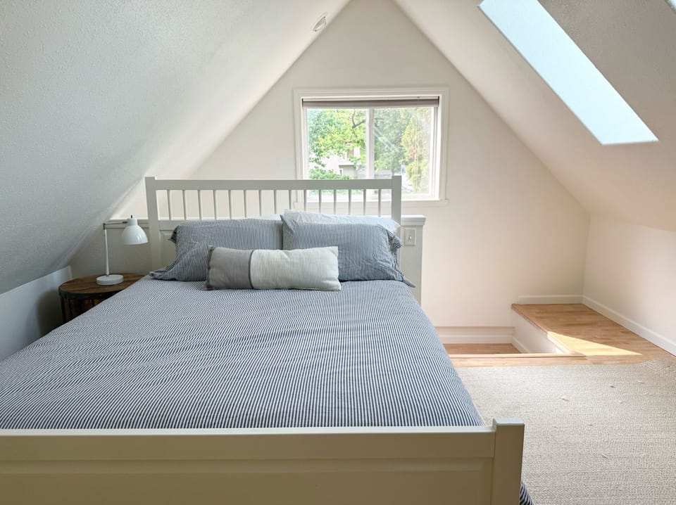 Lofted bedroom has a queen bed and TWO twin beds - all w/ organic cotton sheets.