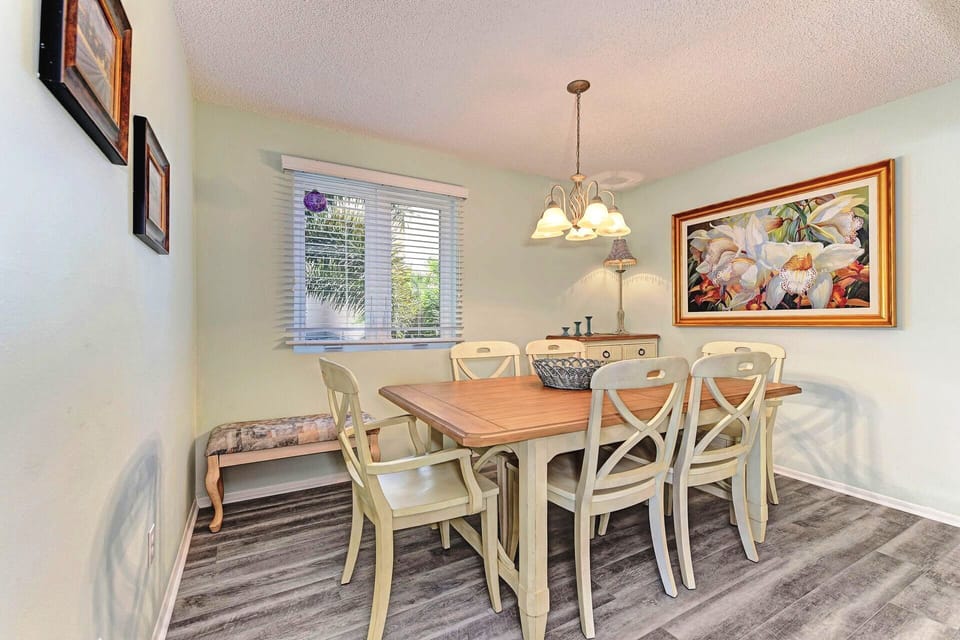 The dining room has new furniture and flooring