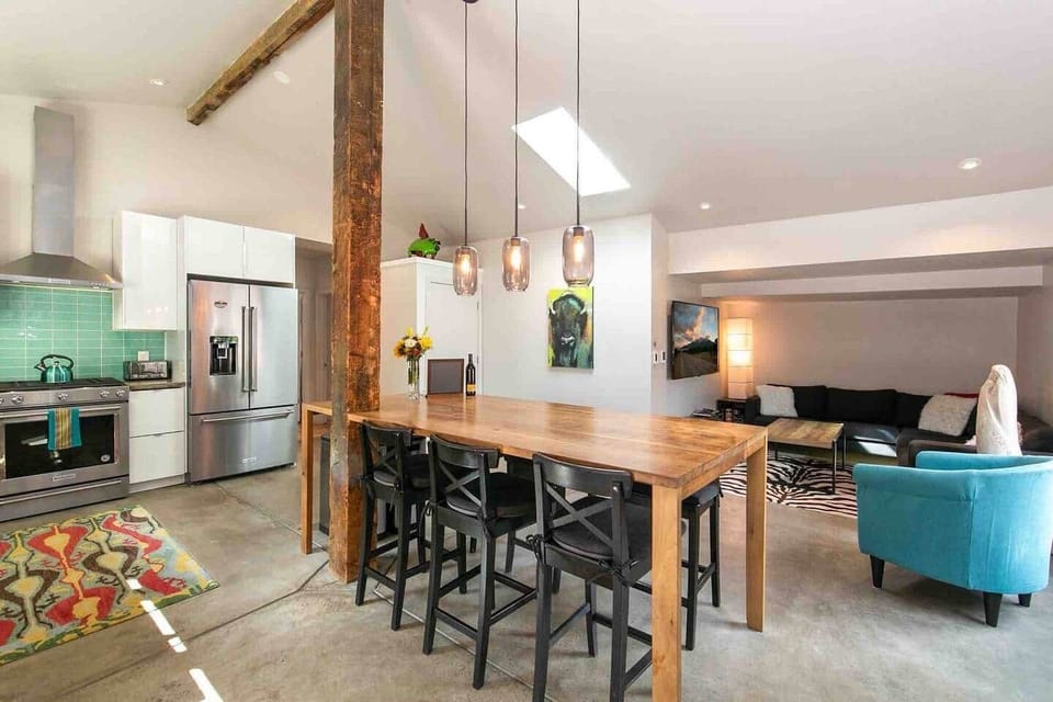 Dining and living space. Spacious open concept, dining and living area with smart TV.