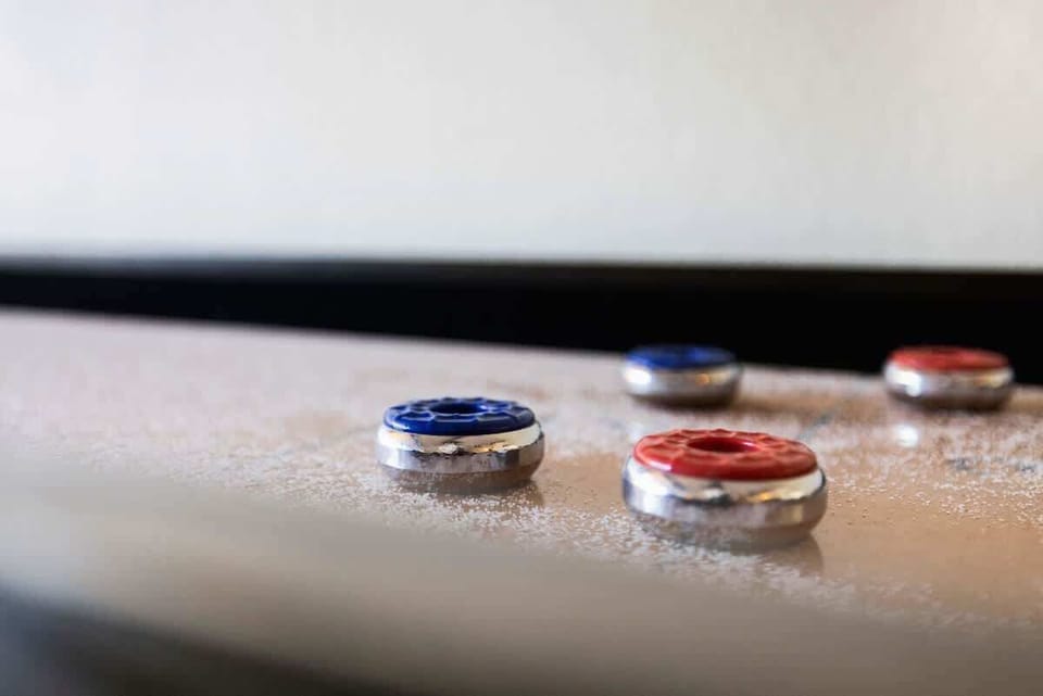 Challenge friends to a game of shuffleboard for endless fun!