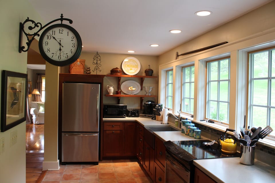 Rabbit Run Farmhouse - Open Amish Kitchen & window wall view of back deck & lawn