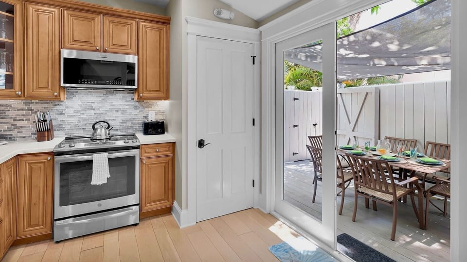 French doors open onto the outdoor dining area, with the private dip pool just beyond...