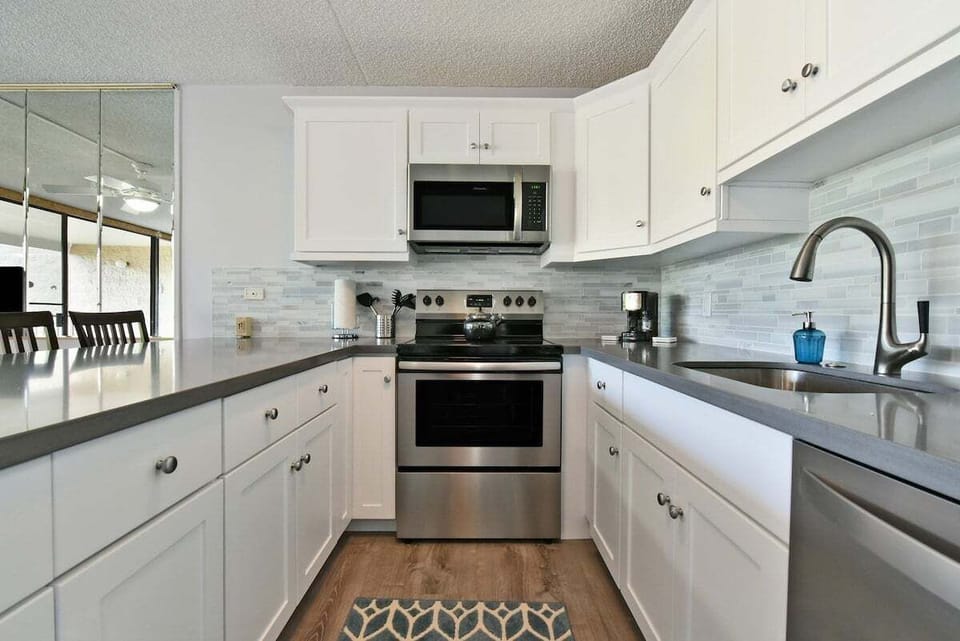 Fully equipped kitchen with modern appliances and bar seating.