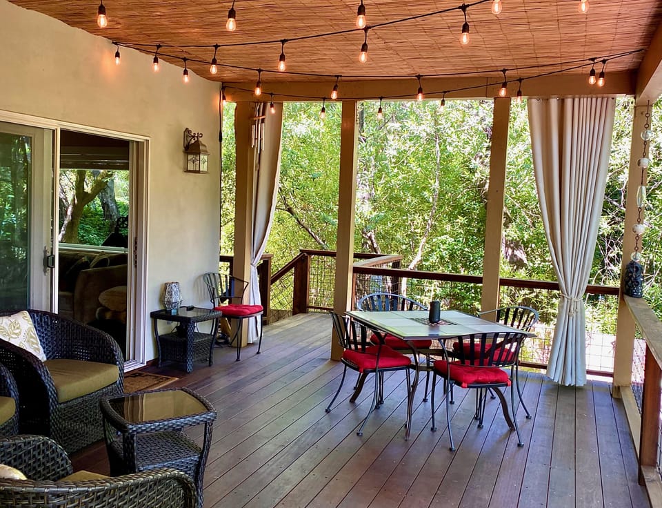 Relax on main deck overlooking creek - direct access to living room & kitchen.
