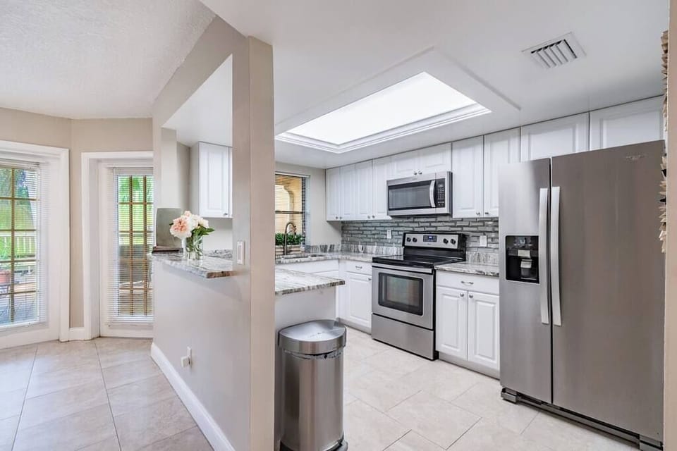 Gourmet kitchen with all new Whirlpool appliances with filtered water and ice in the freezer door.