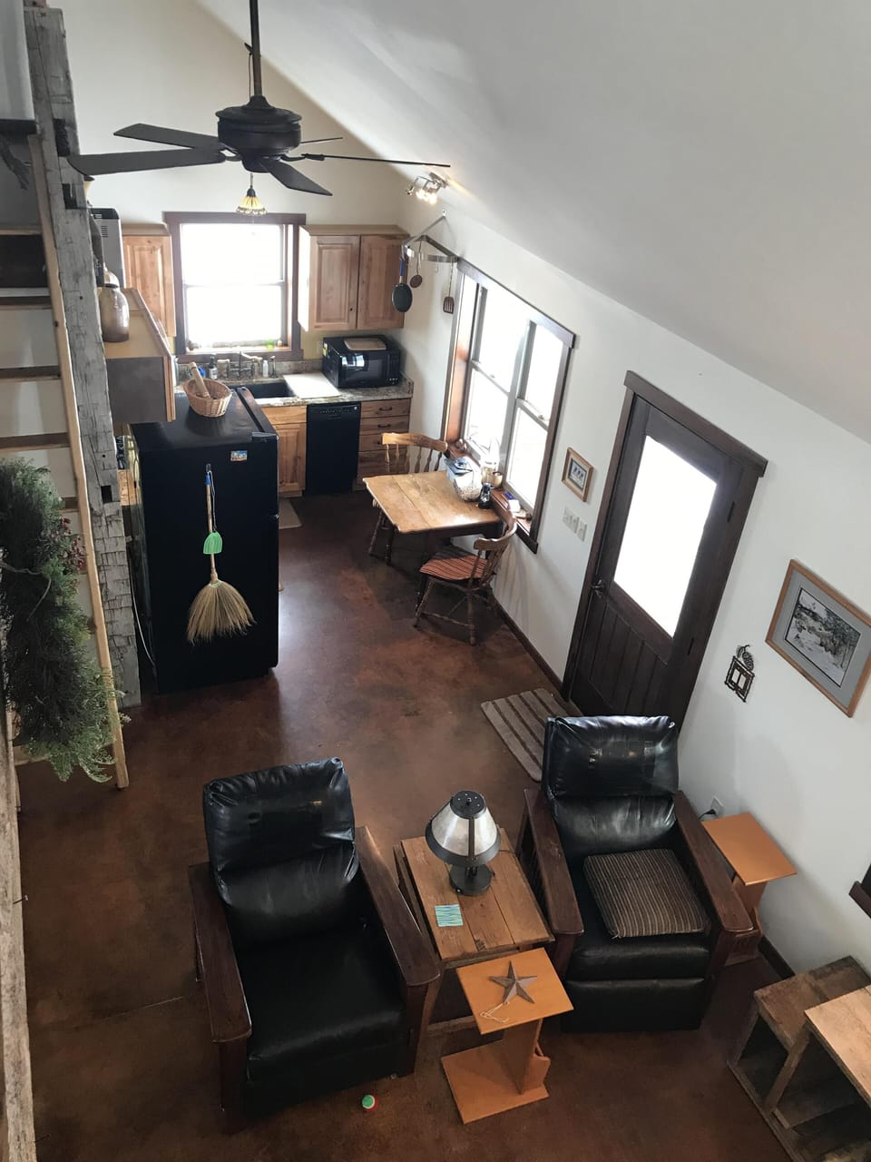 View of living room and kitchen from loft