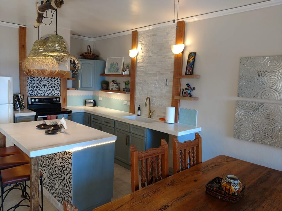 Our remodeled kitchen has everyhing you should need to cook at home if you would like to stay in and dine out on the balcony overlooking the Sea of Cortez. We also have a large island with seating.