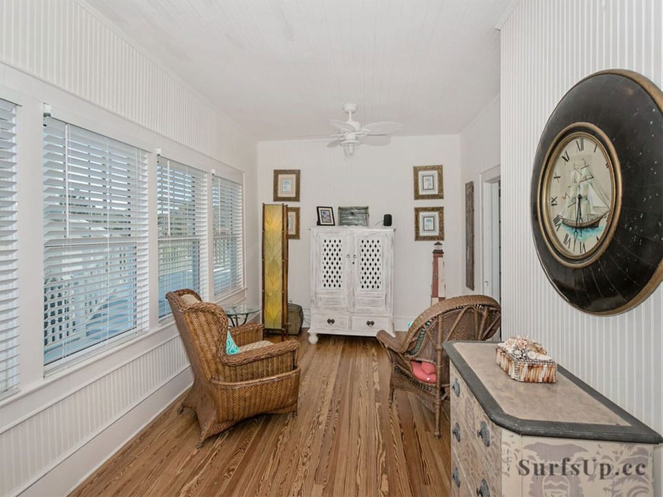 Sunroom with TV in cabinet