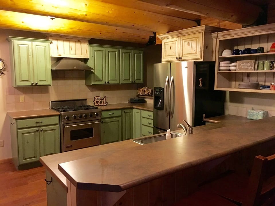 Fully equipped kitchen.  Opening to great room on the other side of the fridge. 