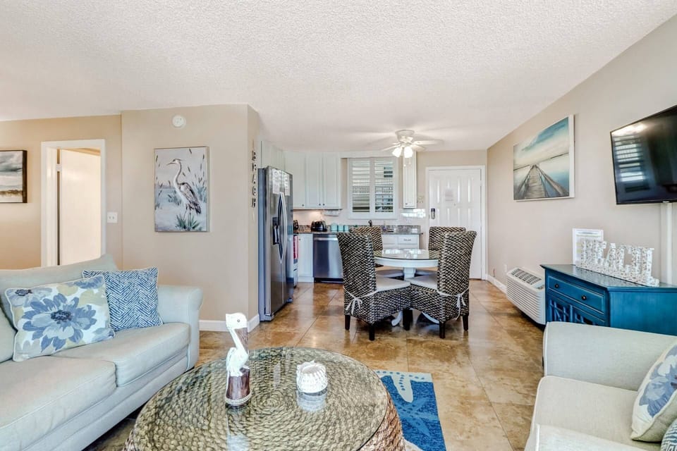 The open living and dining space is clean, uncluttered, and comfortable; perfect for 2 to 4 guests.