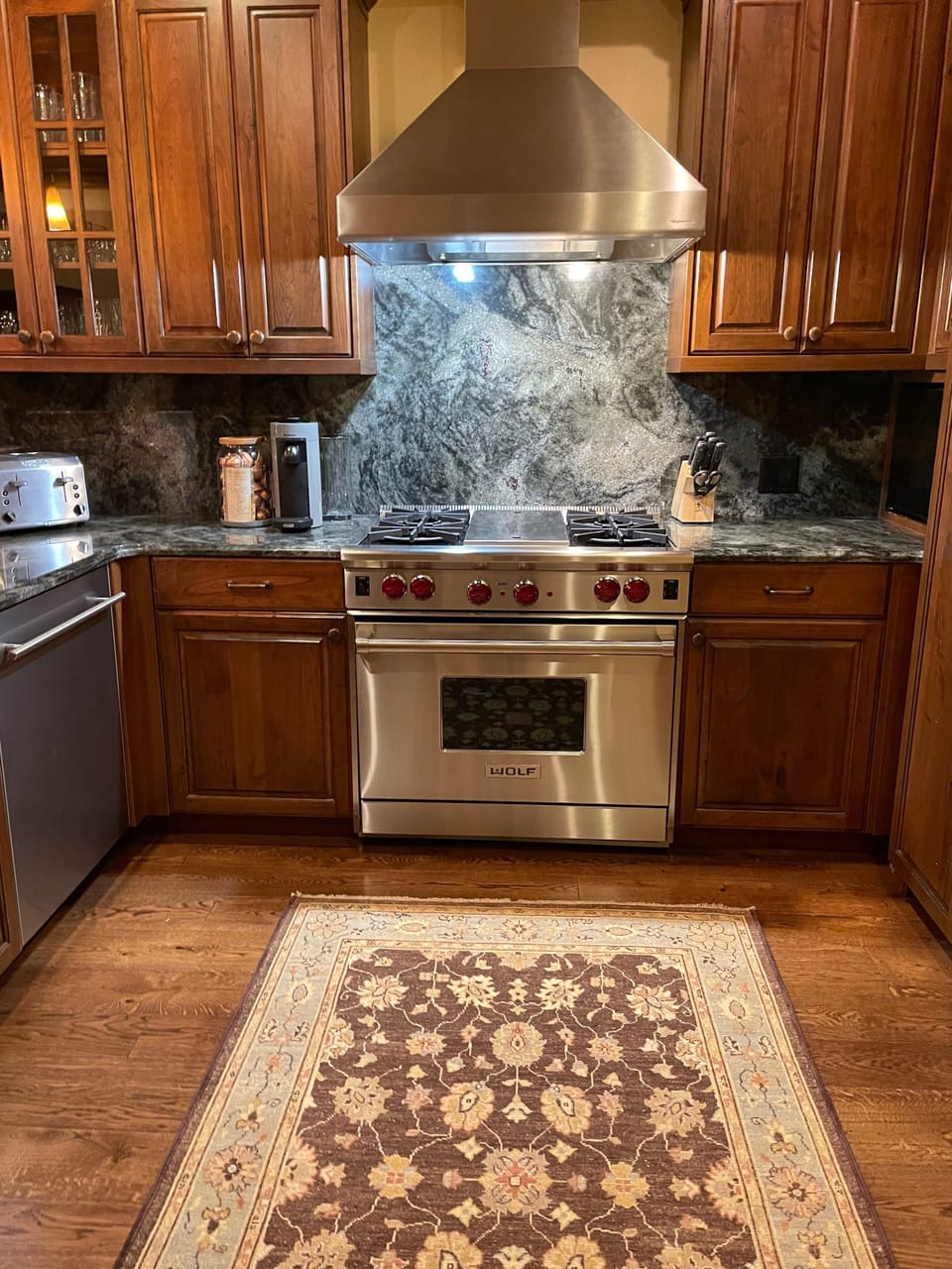 Gourmet kitchen with Wolf gas range and high end appliances