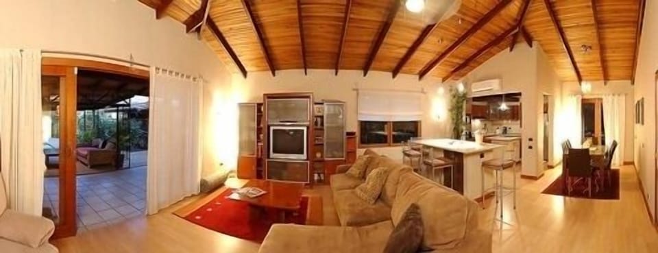 Panorama of living room and kitchen.