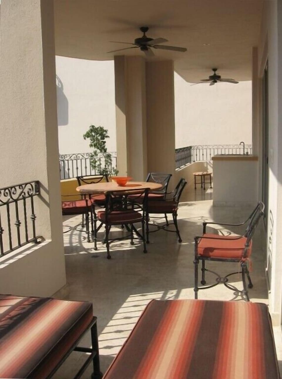 Spacious balcony features a small fridge and propane bbq (not seen)