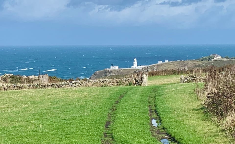 View of Pendeen light house to the right of the house
