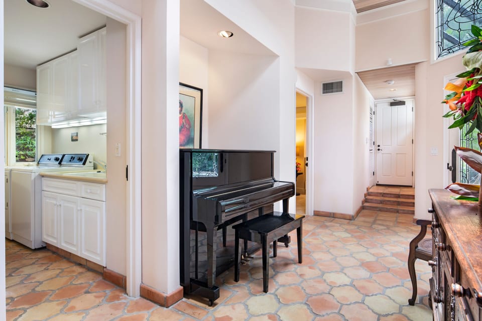Hall way with laundry room left and second bedroom .