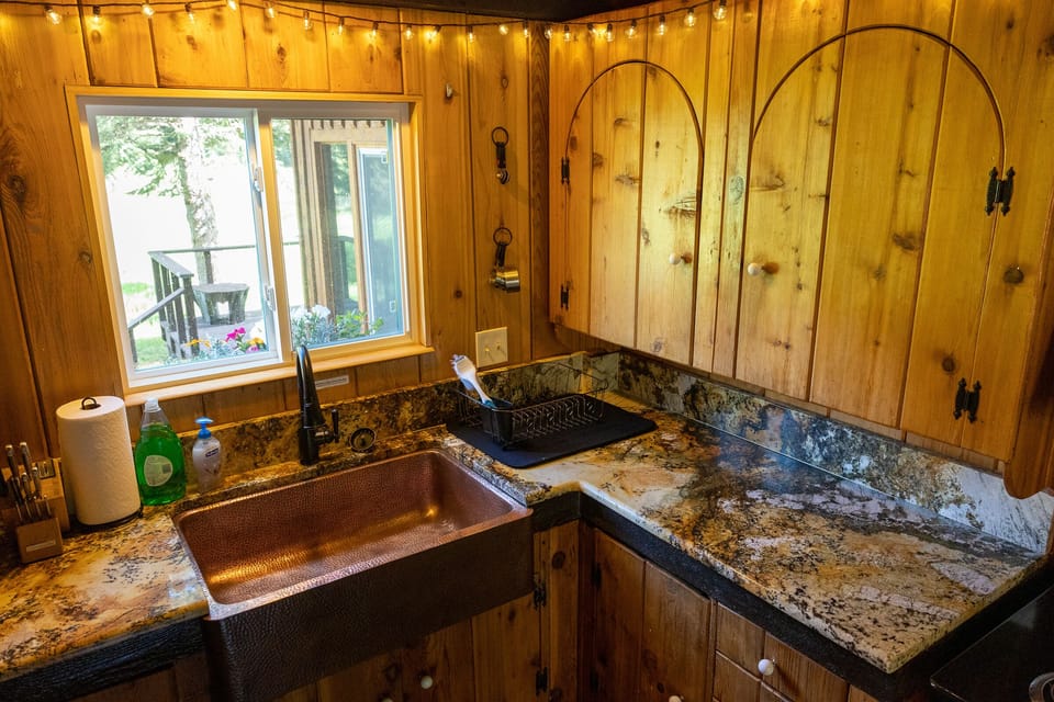 Oversized copper sink in kitchen, overlooking Moose Meadow and Mount Republic