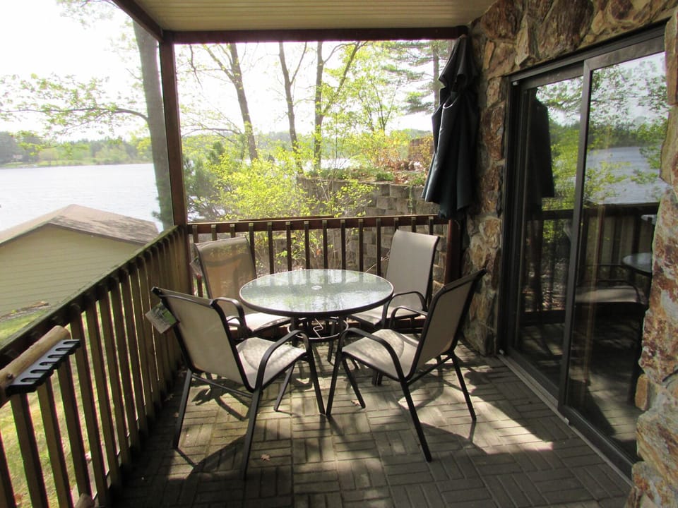 Relax inside the walkout level screen porch