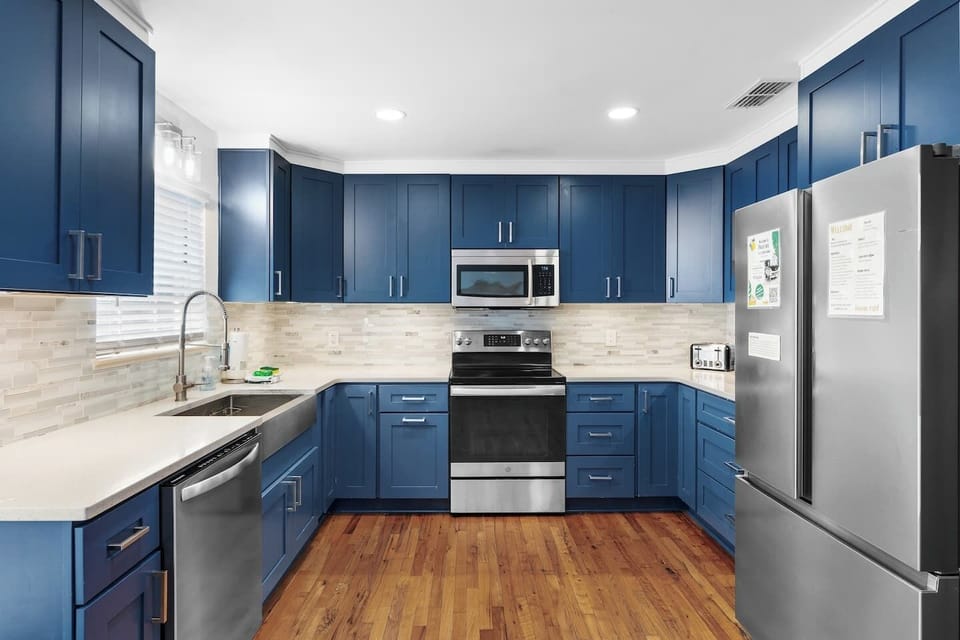 Large Beautiful Kitchen Recently Renovated with Beautiful Coastal Blue Cabinets, Quartz Countertop, Stainless Steel Appliances, Farm Sink and Tons Of Storage 