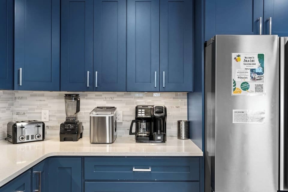 Large Beautiful Kitchen Recently Renovated with Beautiful Coastal Blue Cabinets, Quartz Countertop, Stainless Steel Appliances, Farm Sink and Tons Of Storage 