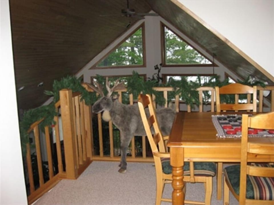 Moose guarding 30 ft. long loft- overlooking great room/lake and game table