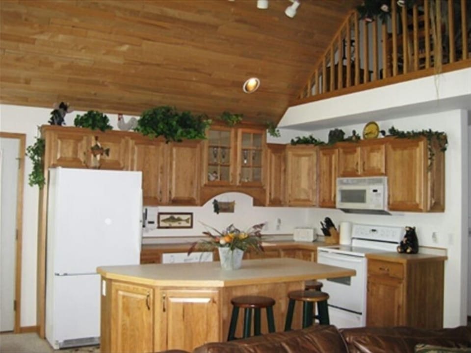 Quarry tile open Kitchen, Bosch dishwasher-3 island bar stools-Loft above