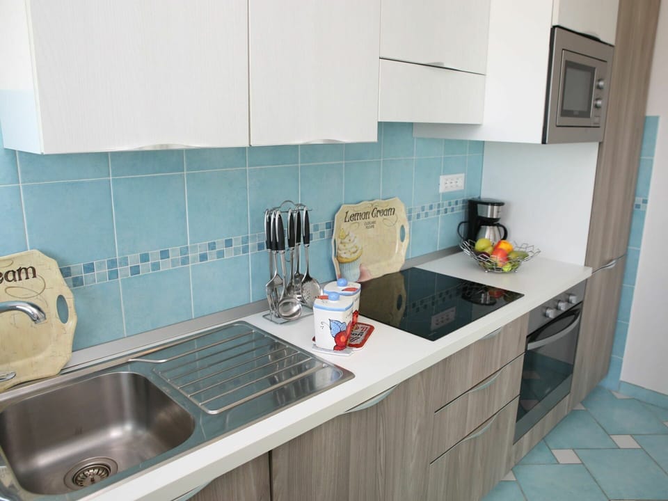 Tap, Kitchen Sink, Sink, Plumbing Fixture, Cabinetry, Countertop, Kitchen, Interior Design, Kitchen Stove, Kitchen Appliance