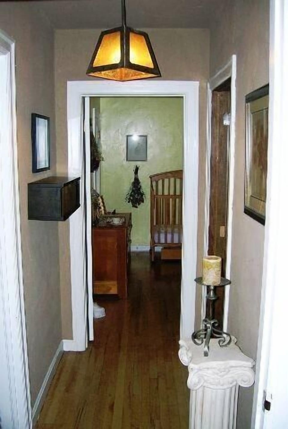 Hallway to second bedroom with queen bed