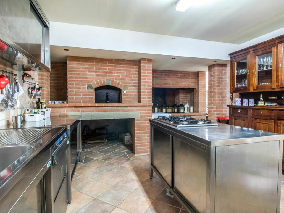 Countertop, Cabinetry, Property, Furniture, Kitchen Stove, Kitchen, Kitchen Appliance, Home Appliance, Wood, Interior Design