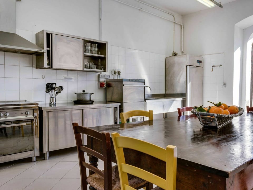 Furniture, Property, Table, Cabinetry, Countertop, Wood, Interior Design, Chair, Kitchen, Kitchen Stove