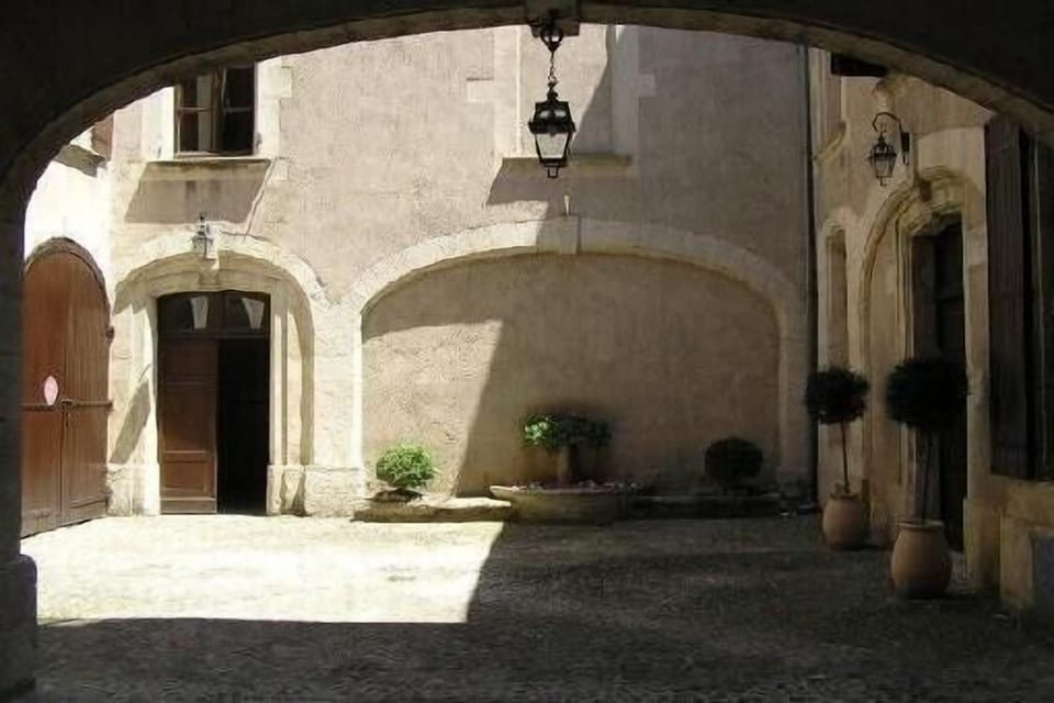 our tall windows (at upper left) look down on the private 17th-century courtyard