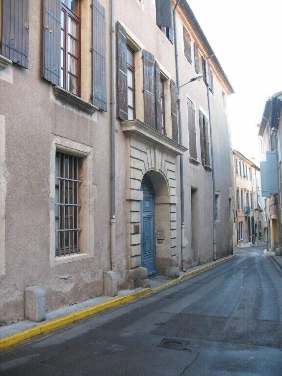 an old photo of the building's exterior on the rue Louis Blanc