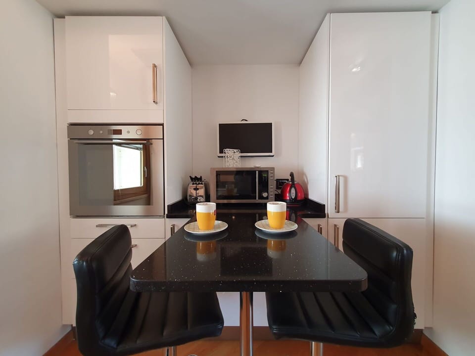 Furniture, Kitchen Appliance, Interior Design, Countertop, Kitchen, Cabinetry, Major Appliance, Flooring, Wood, Home Appliance