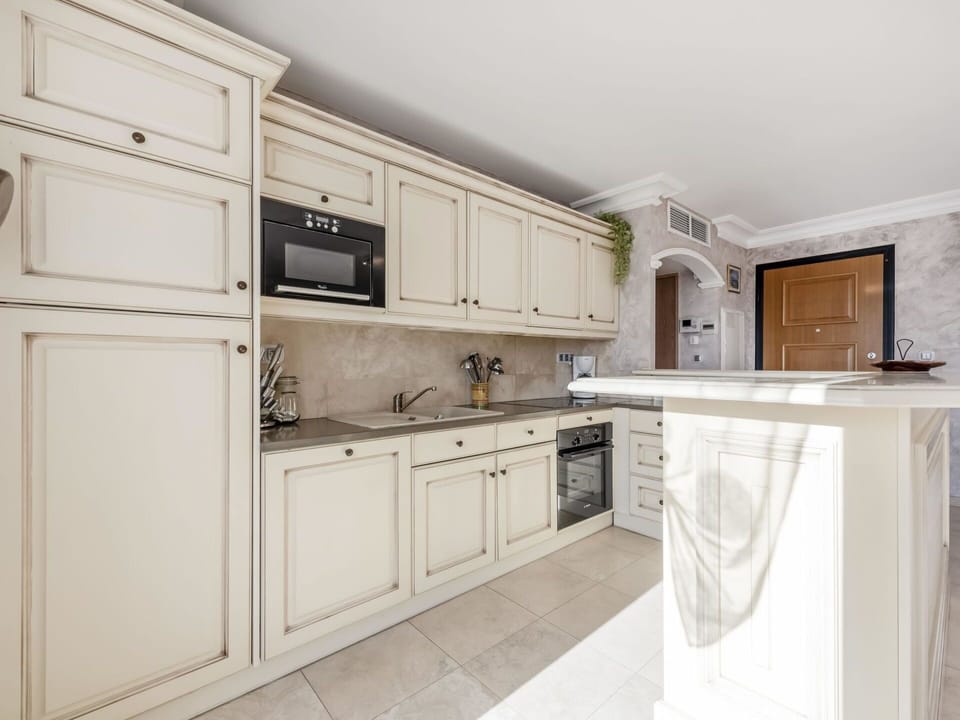 Countertop, Cabinetry, Building, Kitchen Stove, Kitchen Appliance, Kitchen, Drawer, Wood, Interior Design, Stove