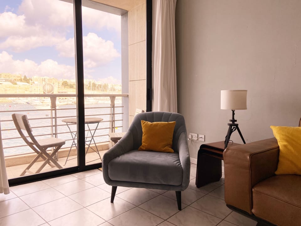 Living room with view onto historic harbour