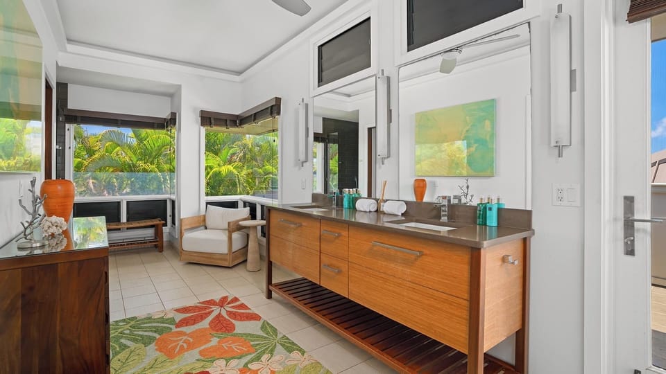 Luxurious bathroom with warm wood finishes and tropical garden views. Sink into relaxation as natural light and lush greenery frame your peaceful sanctuary.