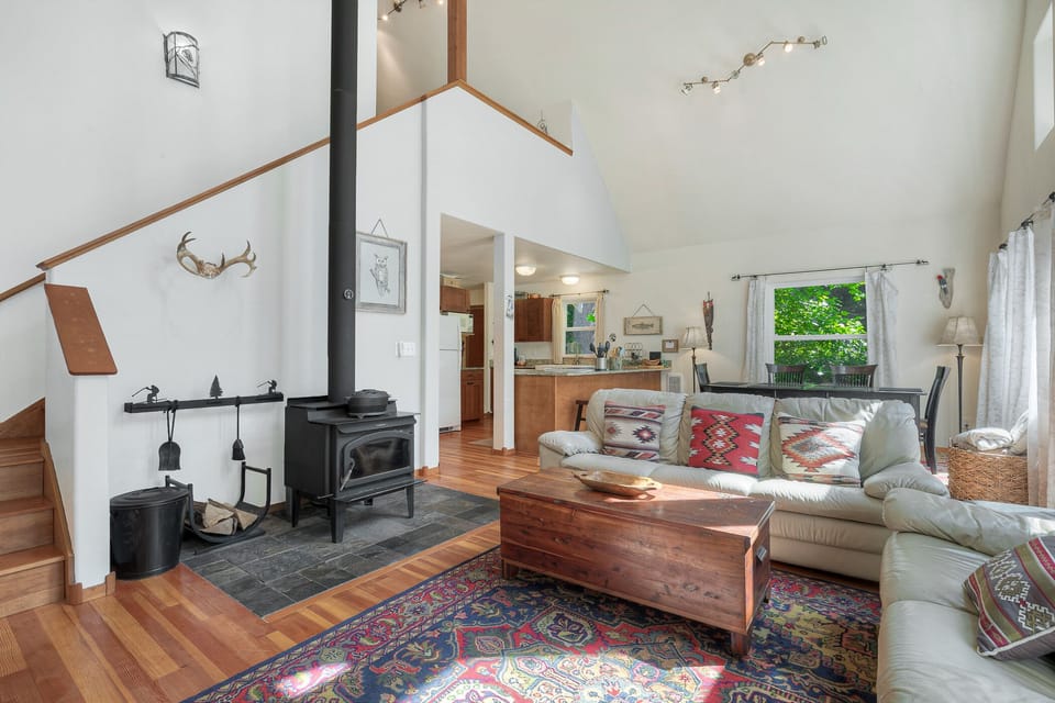 Wood stove - one bundle of long-burning pressed logs provided. Stairs in the back lead to loft bed