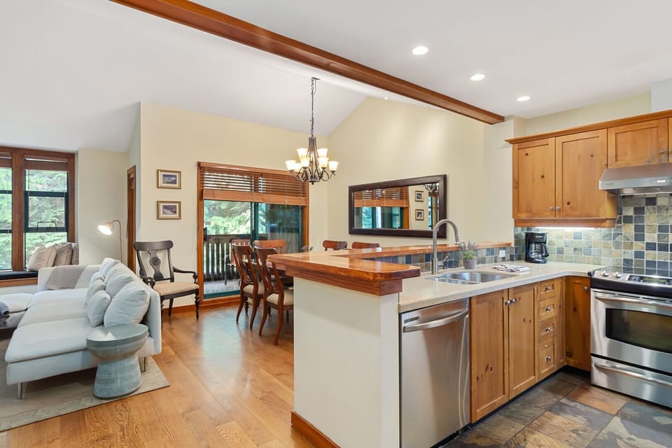 Set under stylish lighting with views to the trees outside.