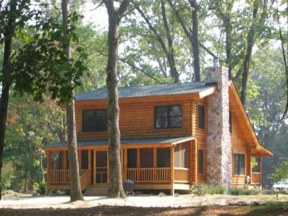 set in tall trees in a quiet neighborhood once a camp & swimming spot from 1850s