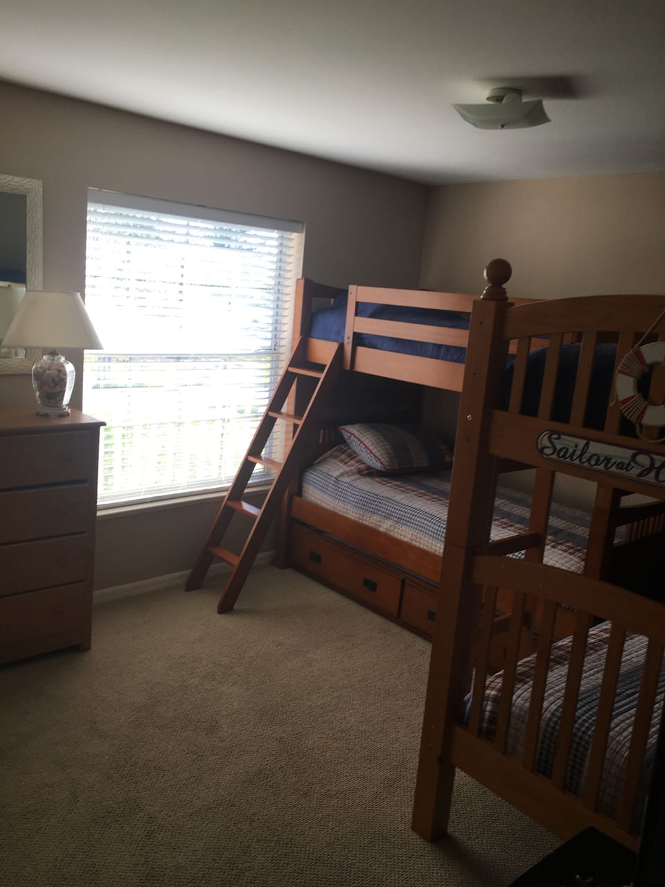 Second bedroom with twin bunk beds and a hide-away trundle and TV