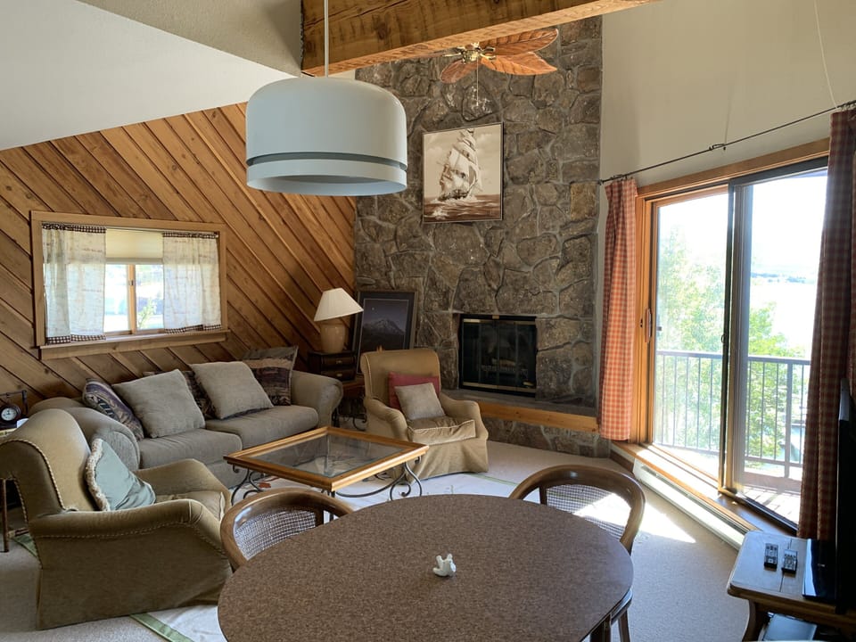 Large open living area and dining area with high ceilings