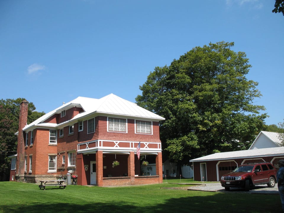 Spacious backyard, parking, patio, grill and picnic area.