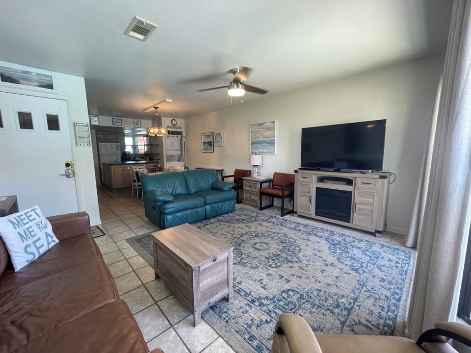 Plenty of seating in living room with 55 inch smart TV and a queen sleeper sofa