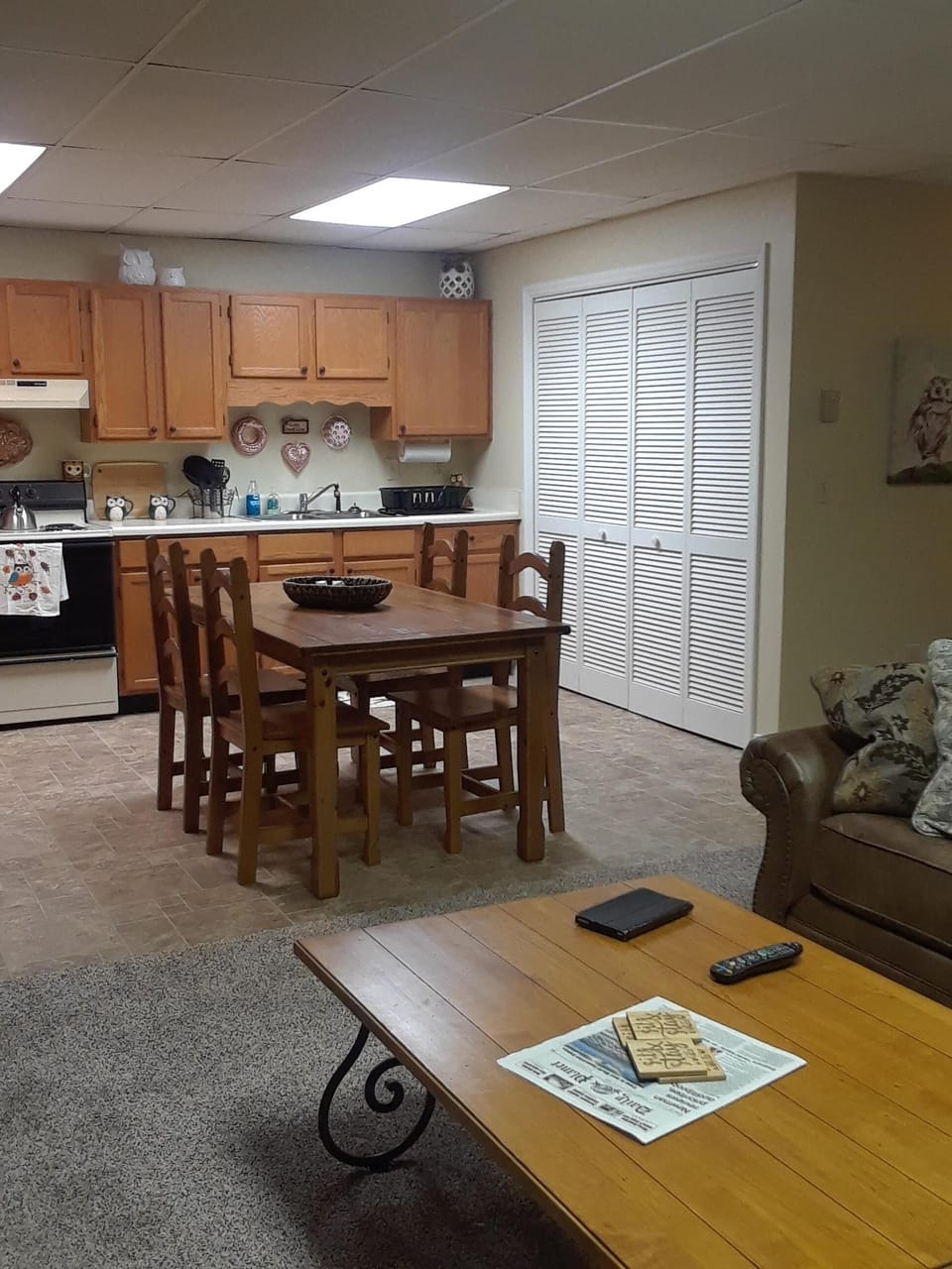 View from living area into kitchen with seating for up to 6 guests