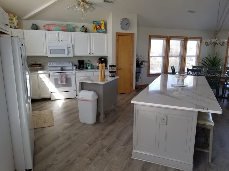 Third floor open concept living room, dining room & kitchen