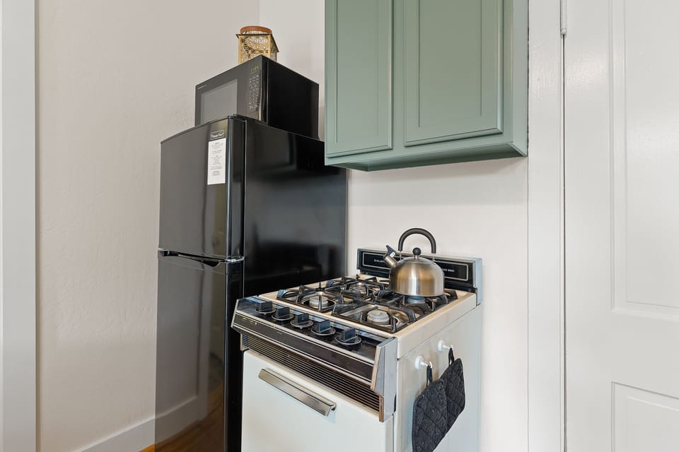 Kitchen refrigerator and stove. 