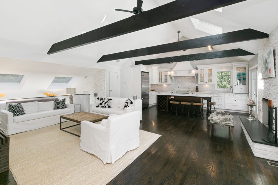 Kitchen & Living Room area with skylights and fire place