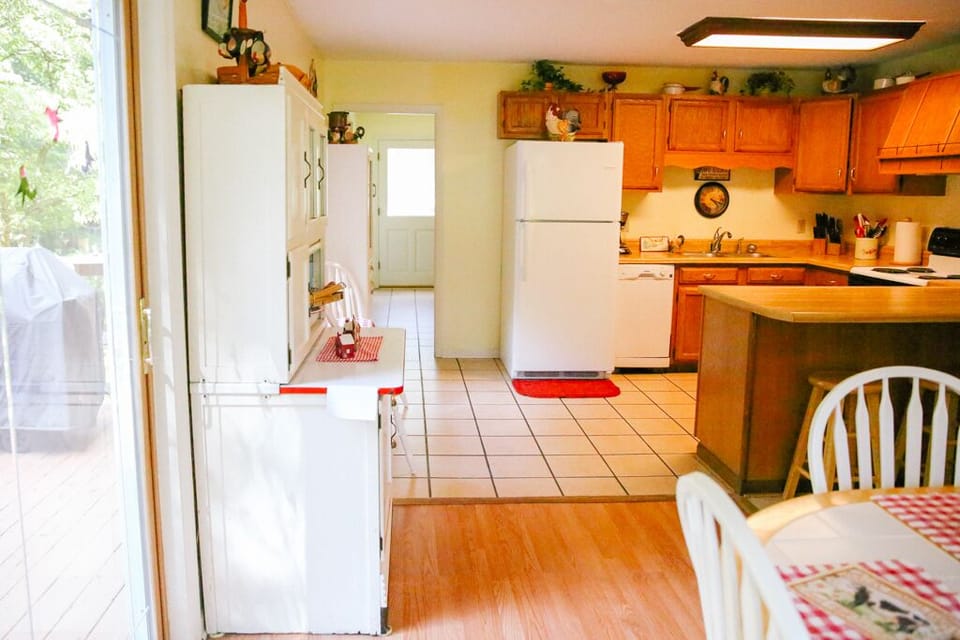 Kitchen on main floor/laundry room behind kitchen