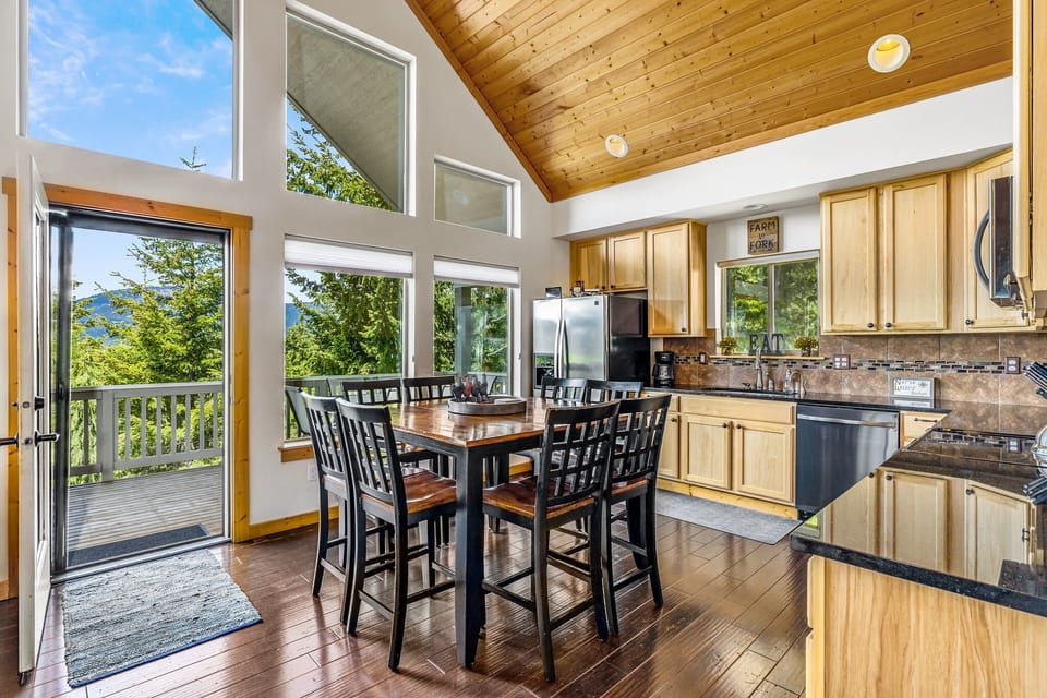 Enjoy the floor to ceiling windows from the living room and kitchen